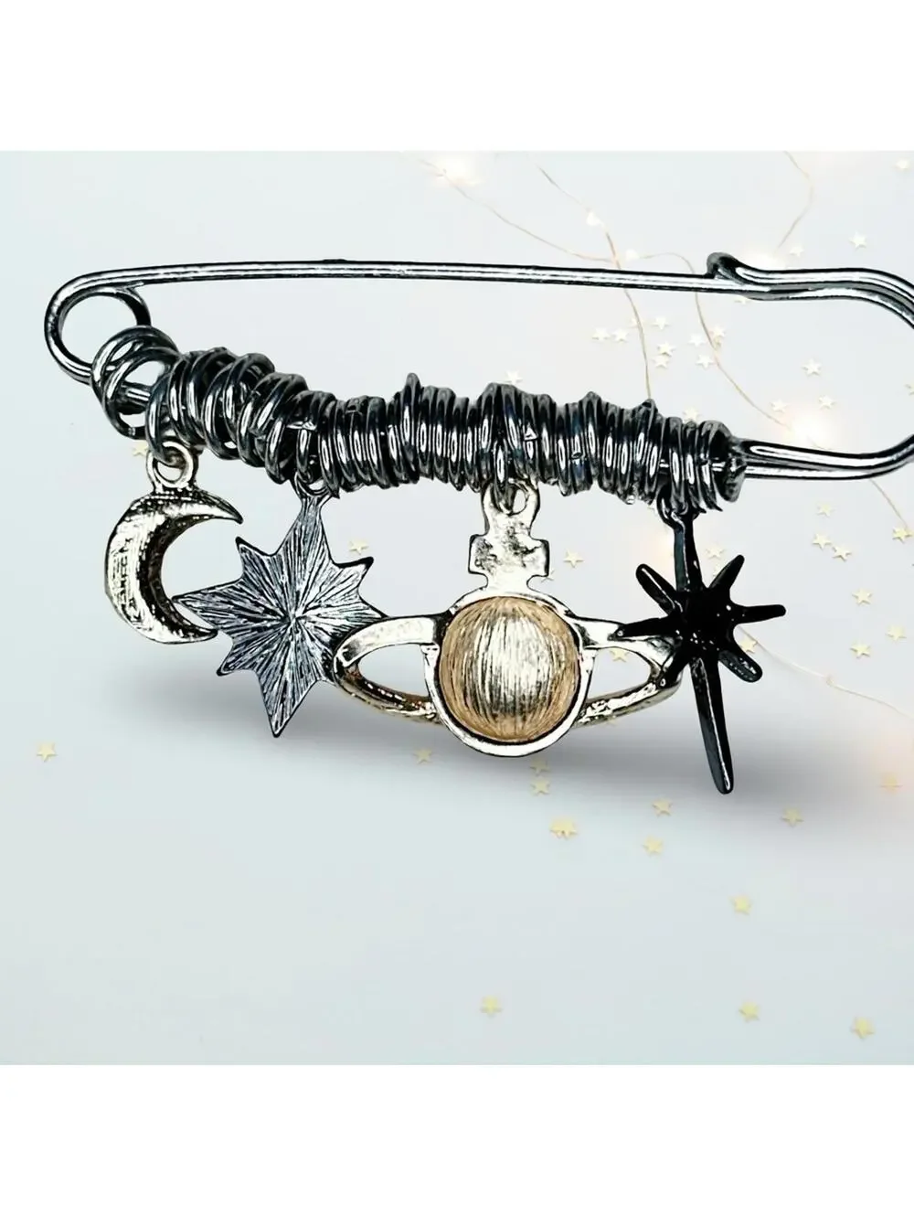 244. Silvertone Celestial Charm Brooch